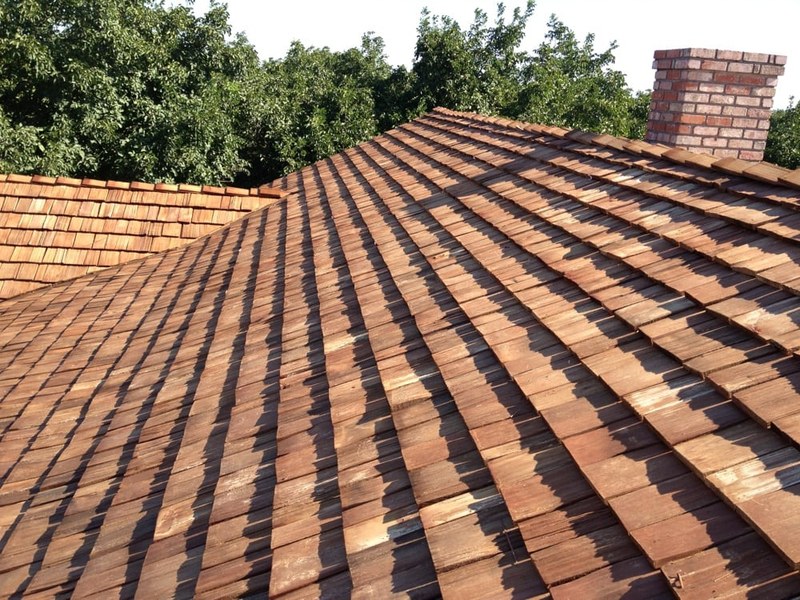 Weathered wood shake roof on a Central Valley home showing storm and age damage before DeHart replacement