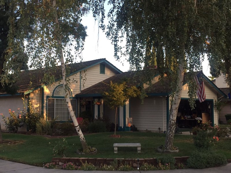 Completed roof on a ranch home photographed at twilight