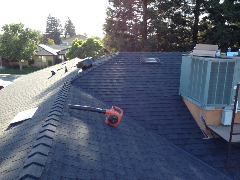 Close-up of a finished roof ridge and rooftop HVAC unit
