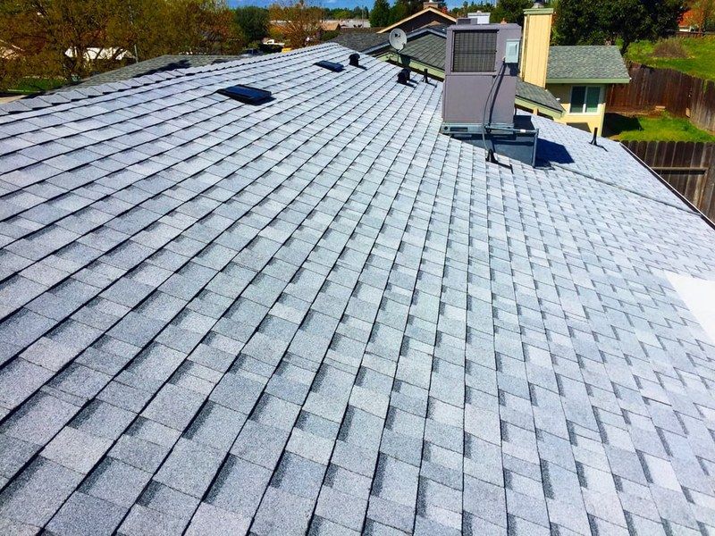Aerial close-up of architectural asphalt shingle pattern installed by DeHart Roofing in Turlock
