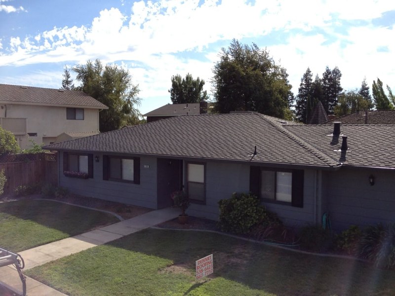 DeHart Roofing yard sign in front of a completed Central Valley project home