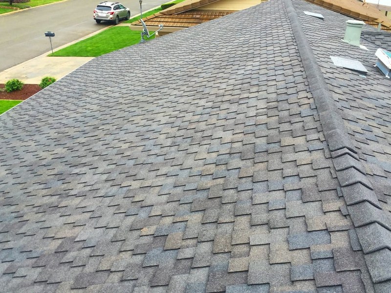 Before and after — full roof replacement on a two-story Central Valley home by DeHart Roofing