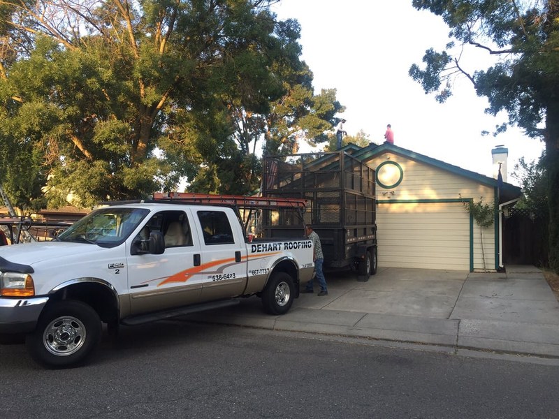 DeHart Roofing crew working together on a residential roof install in Stanislaus County